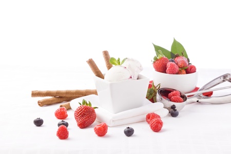 photo of delicious ice cream with berries on the table の写真素材