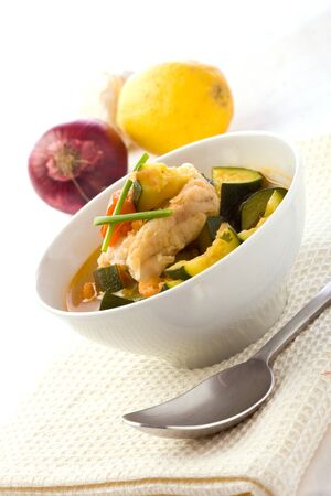 photo of delicious fish soup with cod and zucchiniの写真素材