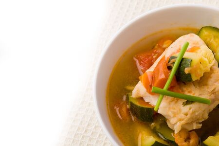 photo of delicious fish soup with cod and zucchiniの写真素材