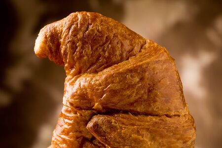 photo of delicious warm and fresh croissants on wooden table