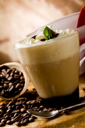 photo of delicious coffee beverage with whipped cream and coffee beansの写真素材