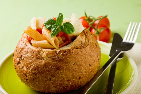 delicious multi grain bread stuffed with pasta on green plateの写真素材