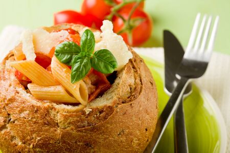 delicious multi grain bread stuffed with pasta on green plateの写真素材