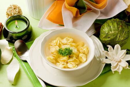 photo of delicious tortellini in bouillon の写真素材
