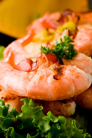 photo of delicious grilled prawns over lettuce bed with peperoniの写真素材