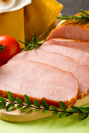 delicious smoked roast beef on wooden cutting boardの写真素材