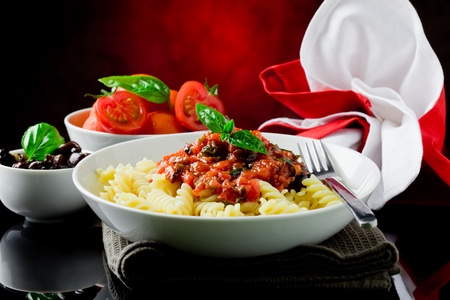 delicious italian pasta with tomato sauce and basil の写真素材