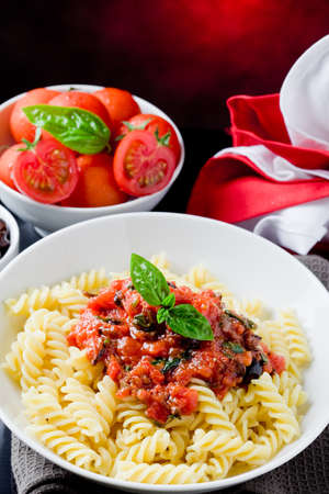 delicious italian pasta with tomato sauce and basil の写真素材