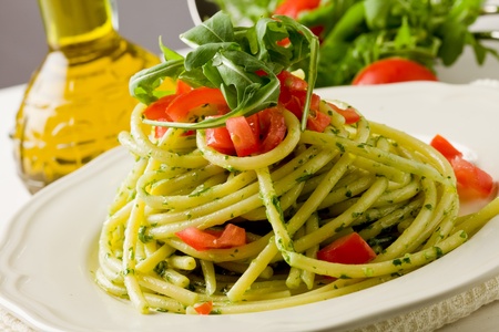 delicious pasta with arugula pesto and cherry tomatoesの写真素材