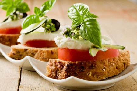  delicious sliced cereal bread with tomato mozzarella の写真素材