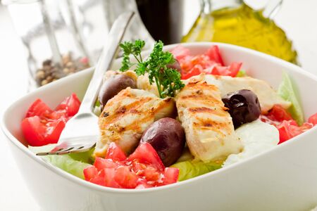 photo of delicious chicken salad on white woden tableの写真素材