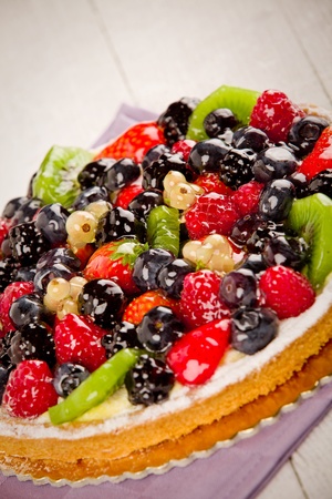 photo of delicious pie with various fruits on wooden tableの写真素材