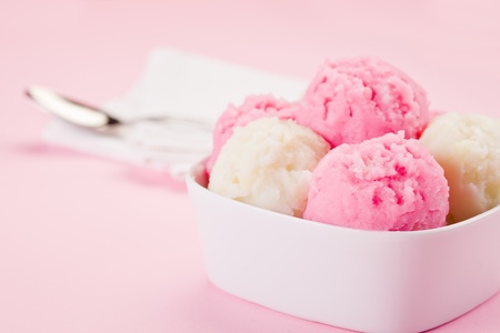 photo of fresh strawberry vanilla ice cream on a rose background
