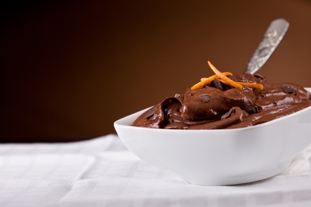 delicious chocolate mousse inside a white bowl with orange zestの写真素材