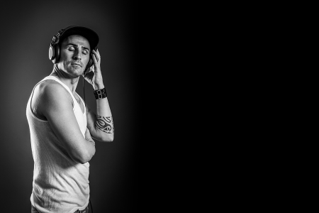 photo of man who is listening to music, black and white photoの写真素材