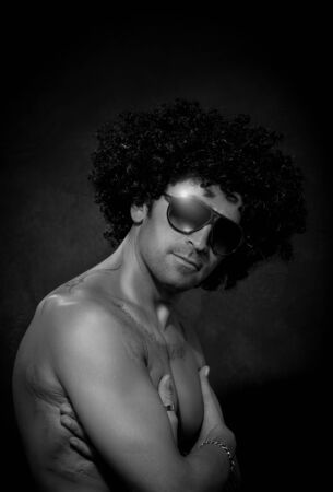 photo of attractive latino guy with sunglassesの写真素材