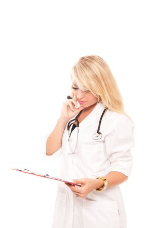 Blonde attractive female doctor with stethoscope - isolatedの写真素材