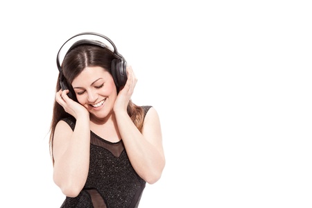 photo of attractive woman with headphones over white backgroundの写真素材