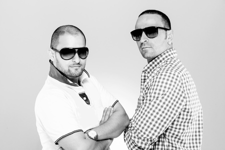 black and white image of two young man with sunglassesの写真素材