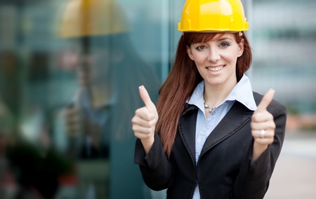 female constructor with blueprintsの写真素材