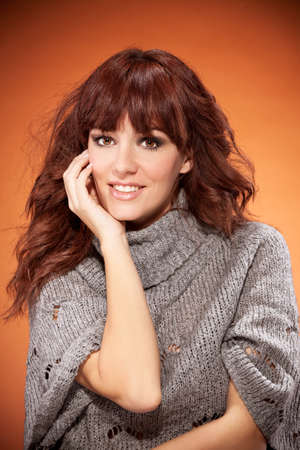 Brunette woman is looking towards the cameraの写真素材
