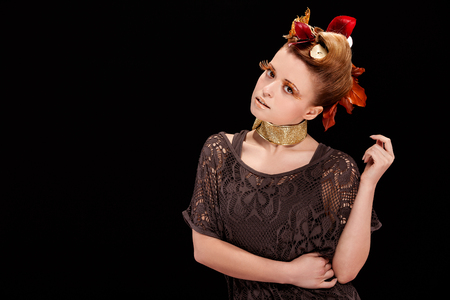 Beauty photo of woman with autumn makeup over black backgroundの写真素材