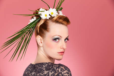 Beauty portrait of woman with great floreal hairstyle and makeupの写真素材