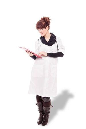 Photo of brunette female doctor over white isolated backgroundの写真素材