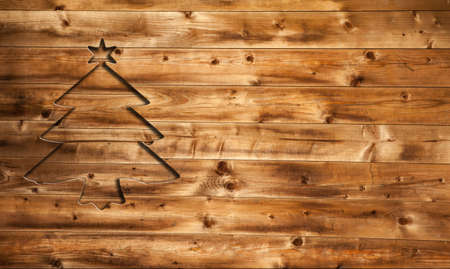 Wooden table with christmas treeの写真素材