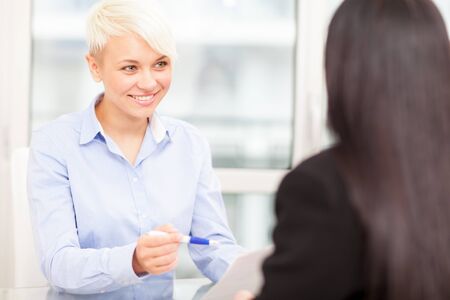 smiling female manager doing a job interviewの写真素材