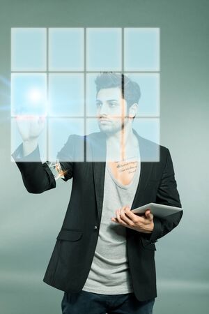 Caucasian man working with digital surface