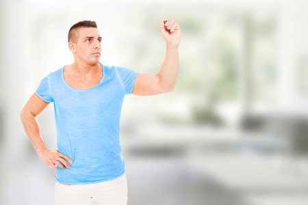 Bodybuilder with pen in his handsの写真素材