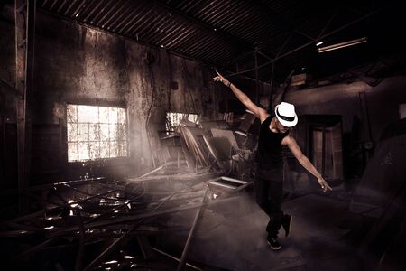 Photo of african guy dancing in ruinsの写真素材