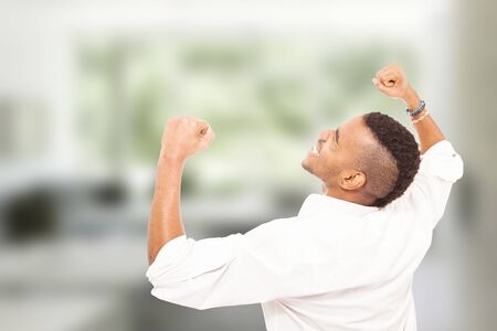 appy african man is making fist and smilingの写真素材