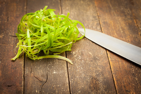 Photo of delicious vegetable a la julienne over wooden tableの写真素材
