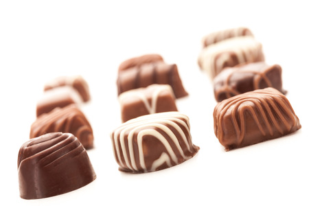 Photo of chocolate pralines over white isolated backgroundの写真素材