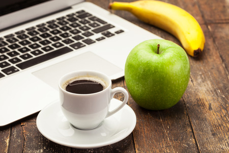 Photo of breakfast while working at computerの写真素材
