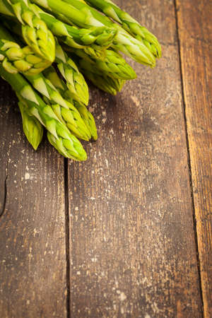 Photo of asparagus over wooden tableの写真素材