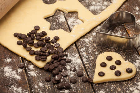 Photo of delicious home made biscuits over wooden tableの写真素材