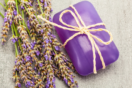Top shot of lavender soap and flover over wooden tableの写真素材