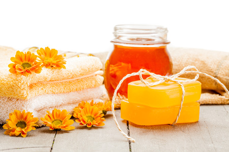 Photo of honey soap over wooden tableの写真素材