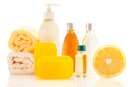 Photo of spa products with lemon over white isolated backgroundの写真素材