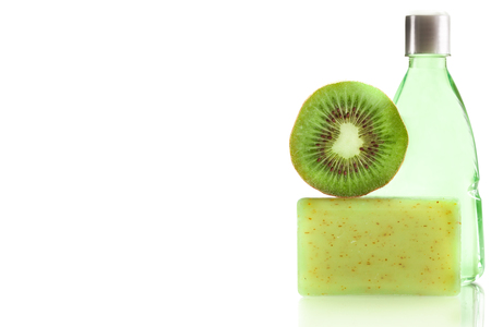 Photo of spa products with kiwi over white isolated backgroundの写真素材