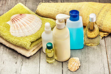 Photo of spa products over wooden tableの写真素材