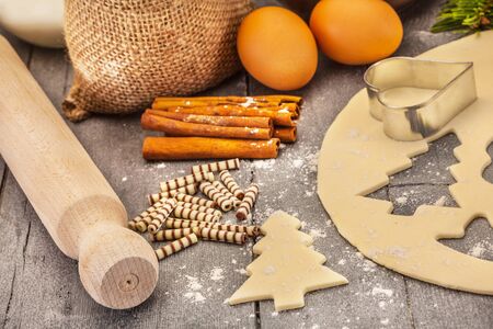 Photo of christmas home made cookies over wooden tableの写真素材