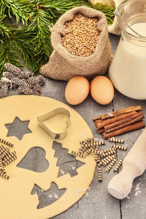 Photo of christmas home made cookies over wooden tableの写真素材