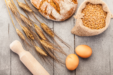 Photo of wheat bread over wooden tableの写真素材