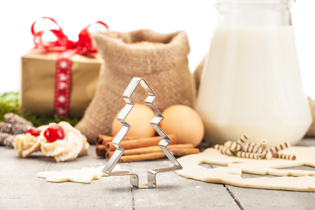 Photo of christmas home made cookies over wooden tableの写真素材