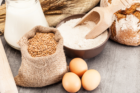 Wheat grains and flourの写真素材