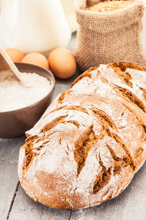 Photo of wheat bread over wooden tableの写真素材